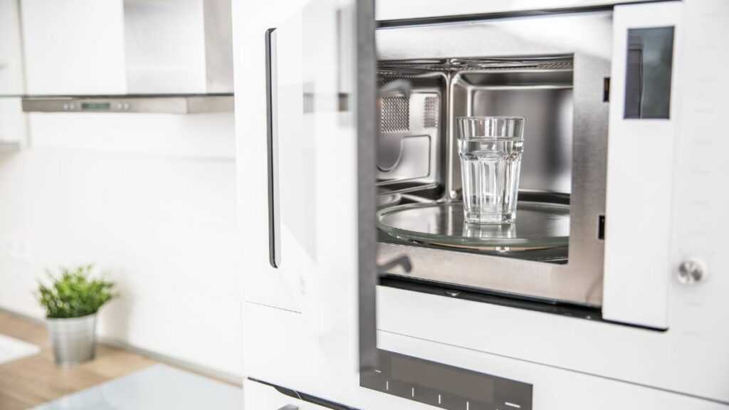 A modern kitchen with built-in microwave