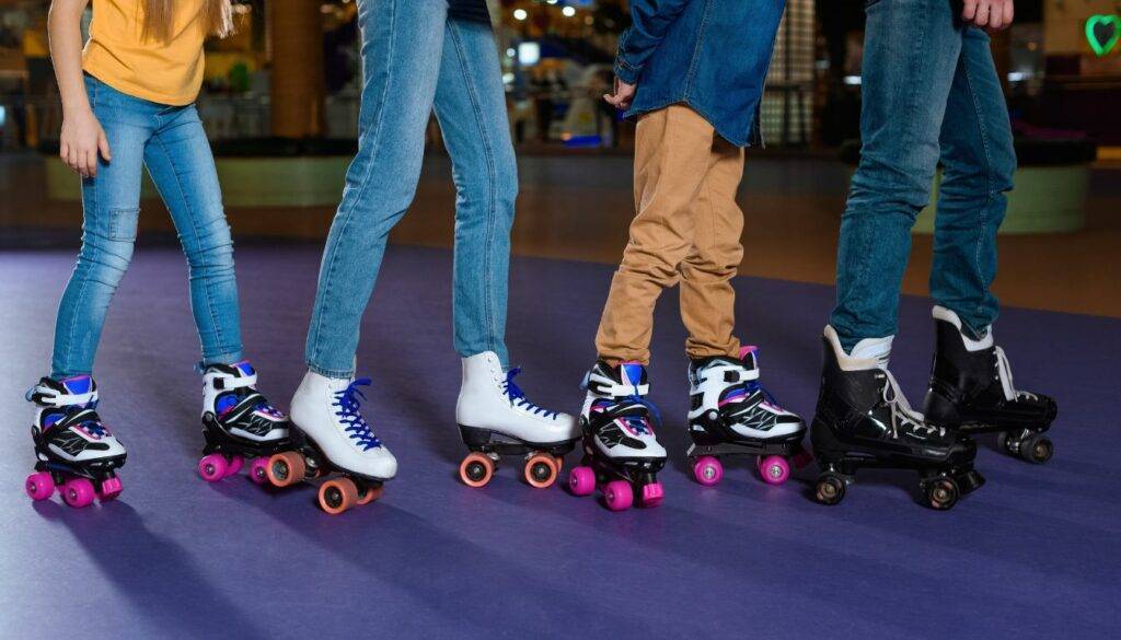 Roller skates gliding on a smooth urban sidewalk in a bustling city.